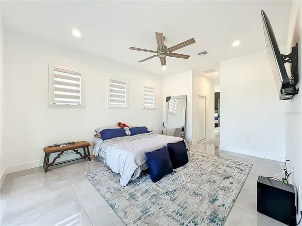 a bed room with a bed and a chandelier