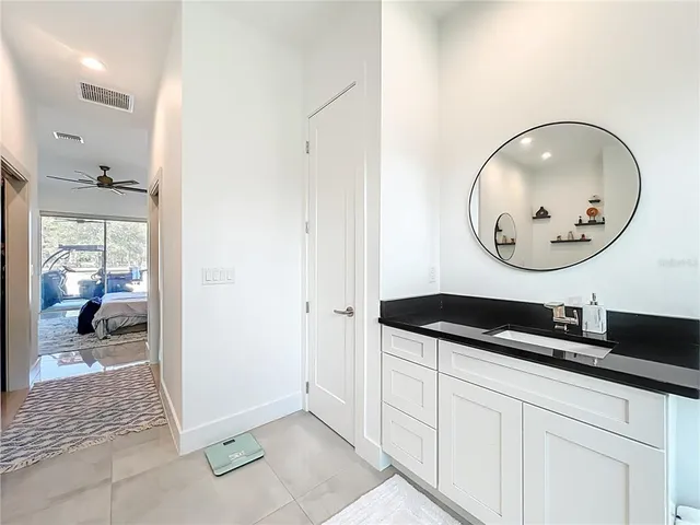 a bed room with a bed and a chandelier