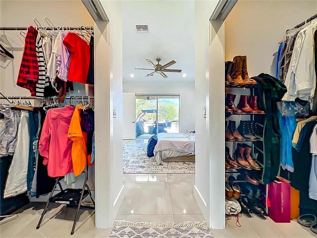 540 Northwest 165th Ct Road Dunnellon, FL 34432 - Photo 43 of 85 a view of walk in closet with clothes and shoes