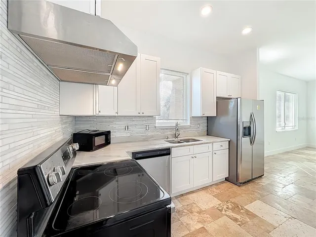 a front view of house with an outdoor space