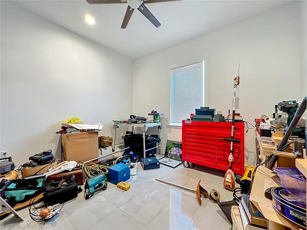 540 Northwest 165th Ct Road Dunnellon, FL 34432 - Photo 52 of 85 a room with gym equipment and a flat screen tv