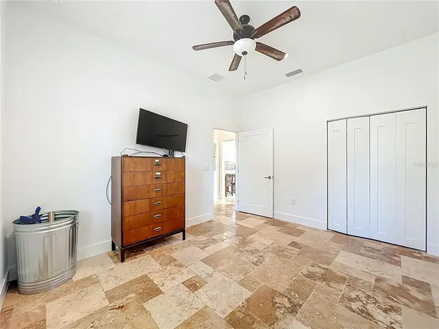 a view of a house with backyard and tree