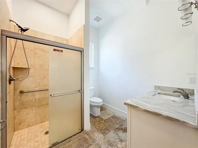 a picture of a bathroom with a shower