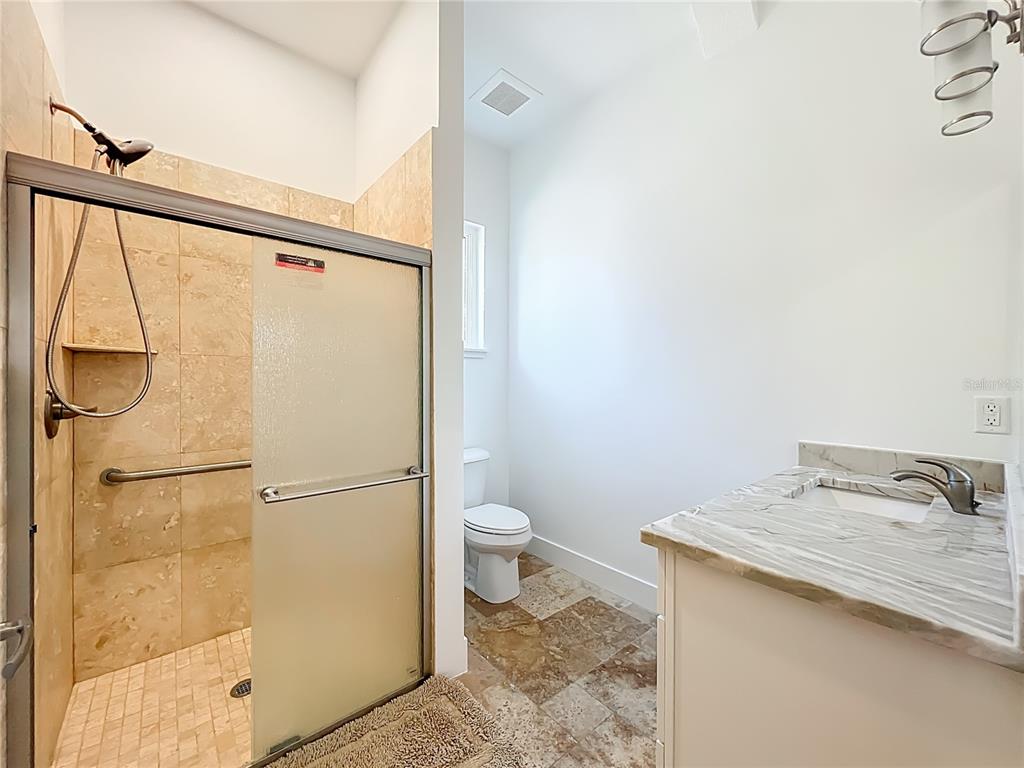 540 Northwest 165th Ct Road Dunnellon, FL 34432 - Photo 57 of 85 a bathroom with a granite countertop sink toilet and shower