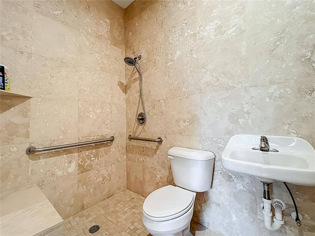 540 Northwest 165th Ct Road Dunnellon, FL 34432 - Photo 62 of 85 a bathroom with a toilet a sink and a shower
