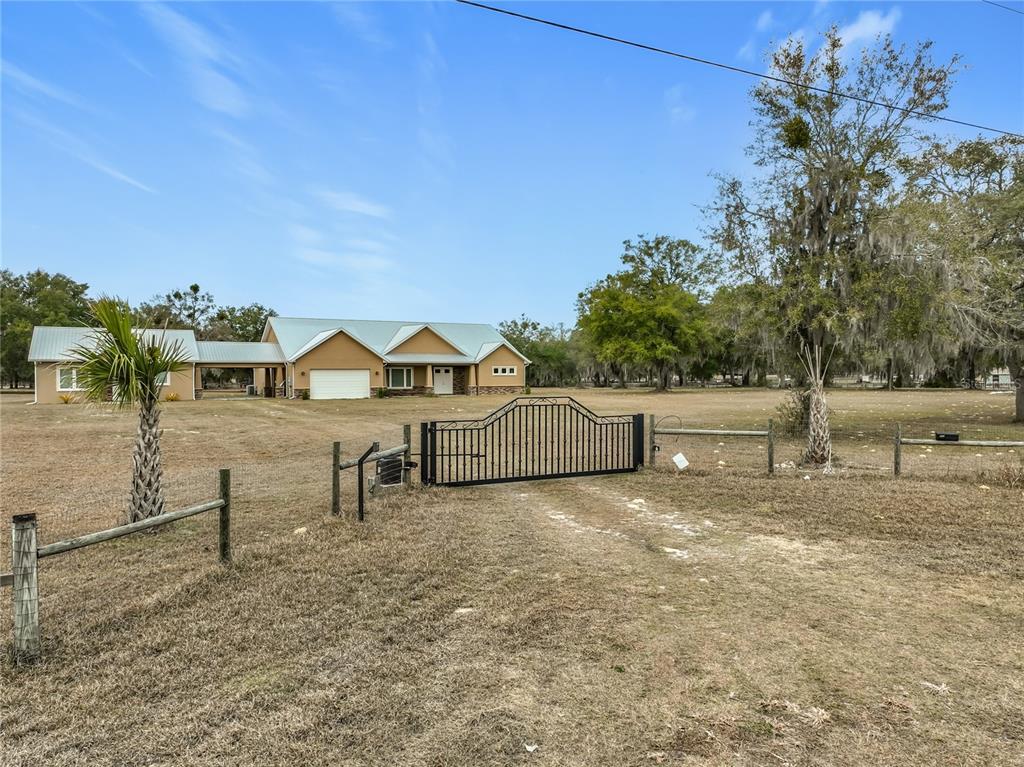 540 Northwest 165th Ct Road Dunnellon, FL 34432 - Photo 10 of 85 a view of a house with a yard and sitting area