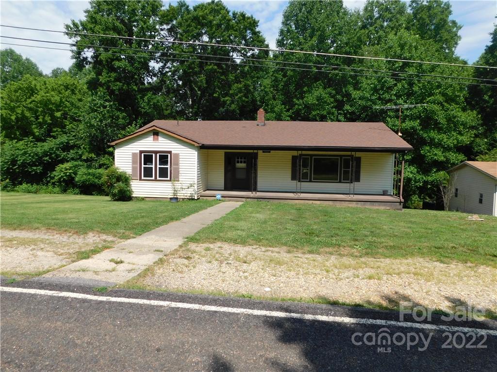 1468 Jacktown Road Marion, NC 28752 - Photo 1 of 19 a front view of a house with garden