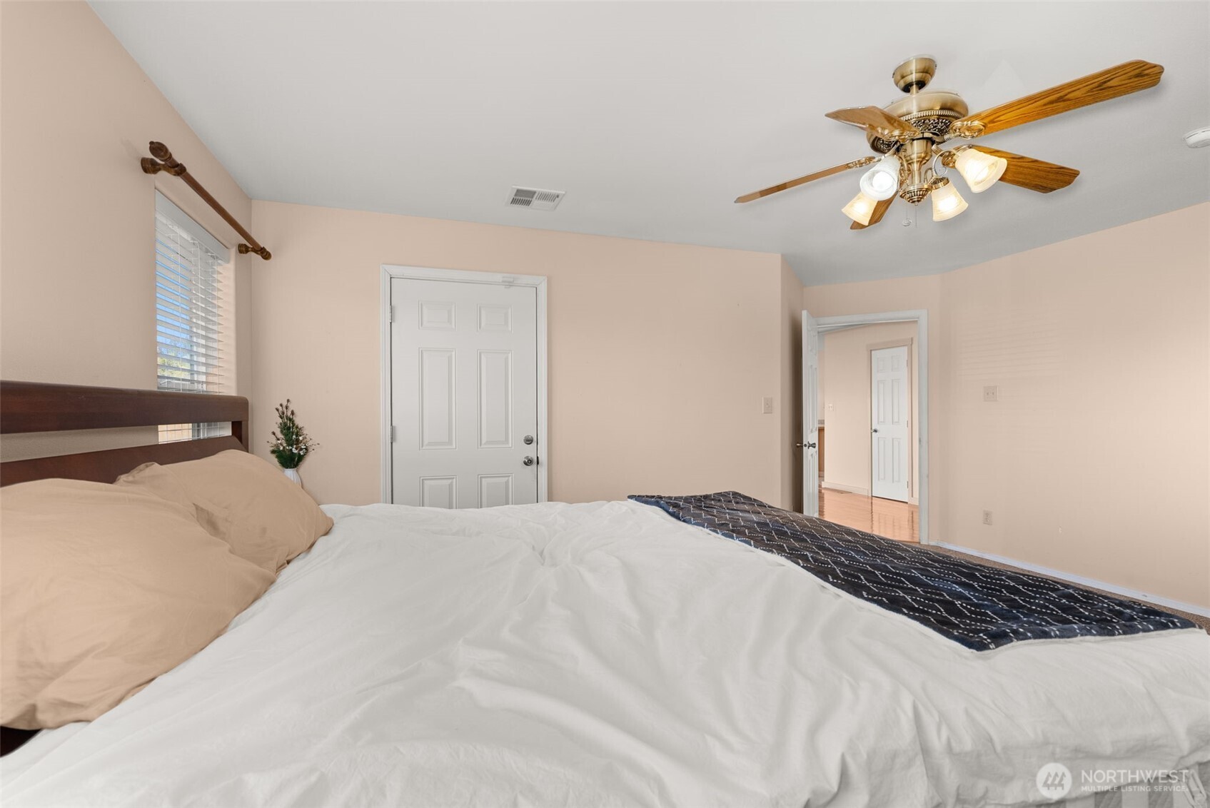 395 Ceres Hill Road Chehalis, WA 98532 - Photo 18 of 40 a bedroom with a large bed and a chandelier