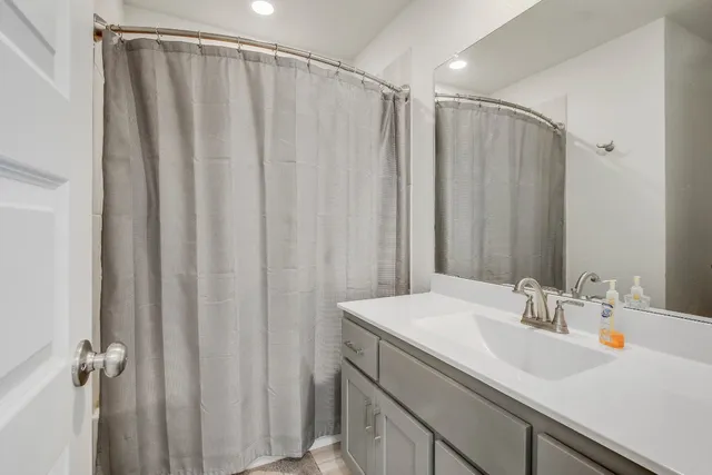 a bathroom with a sink a vanity and mirror