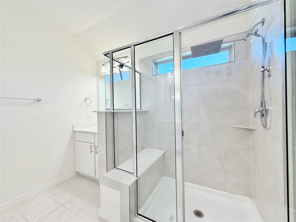 1336 Morning View Road Georgetown, TX 78628 - Photo 19 of 40 A well-appointed bath features a spacious shower with sleek glass enclosure and contemporary fixtures.