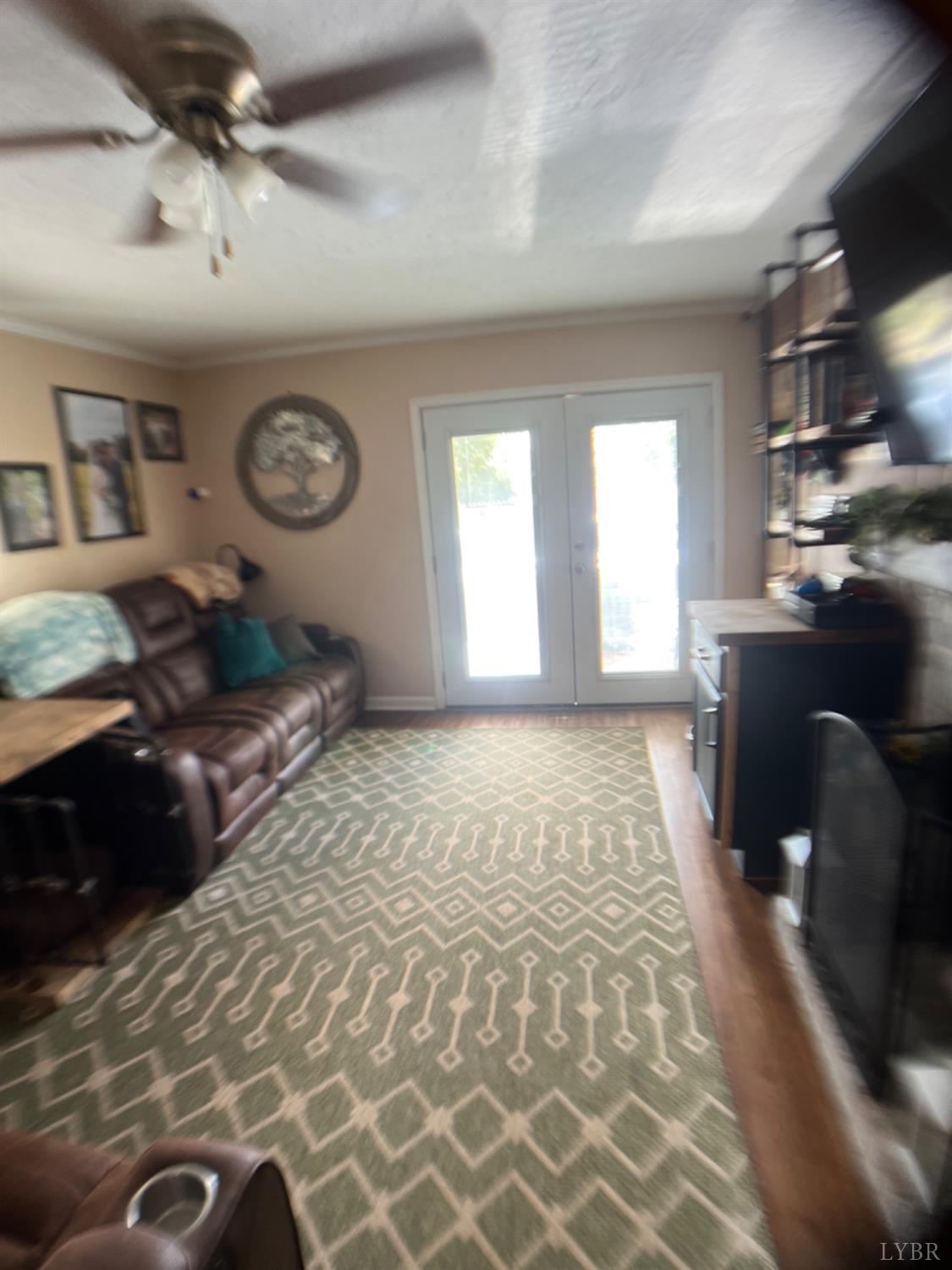 697 Stone Mill Road Hurt, VA 24563 - Photo 3 of 31 a view of a livingroom with wooden floor