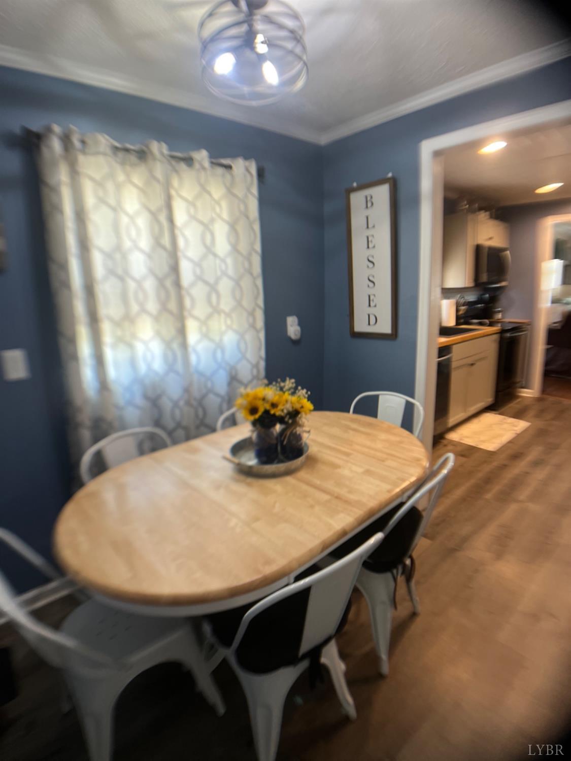 697 Stone Mill Road Hurt, VA 24563 - Photo 9 of 31 a dining table with chairs and window
