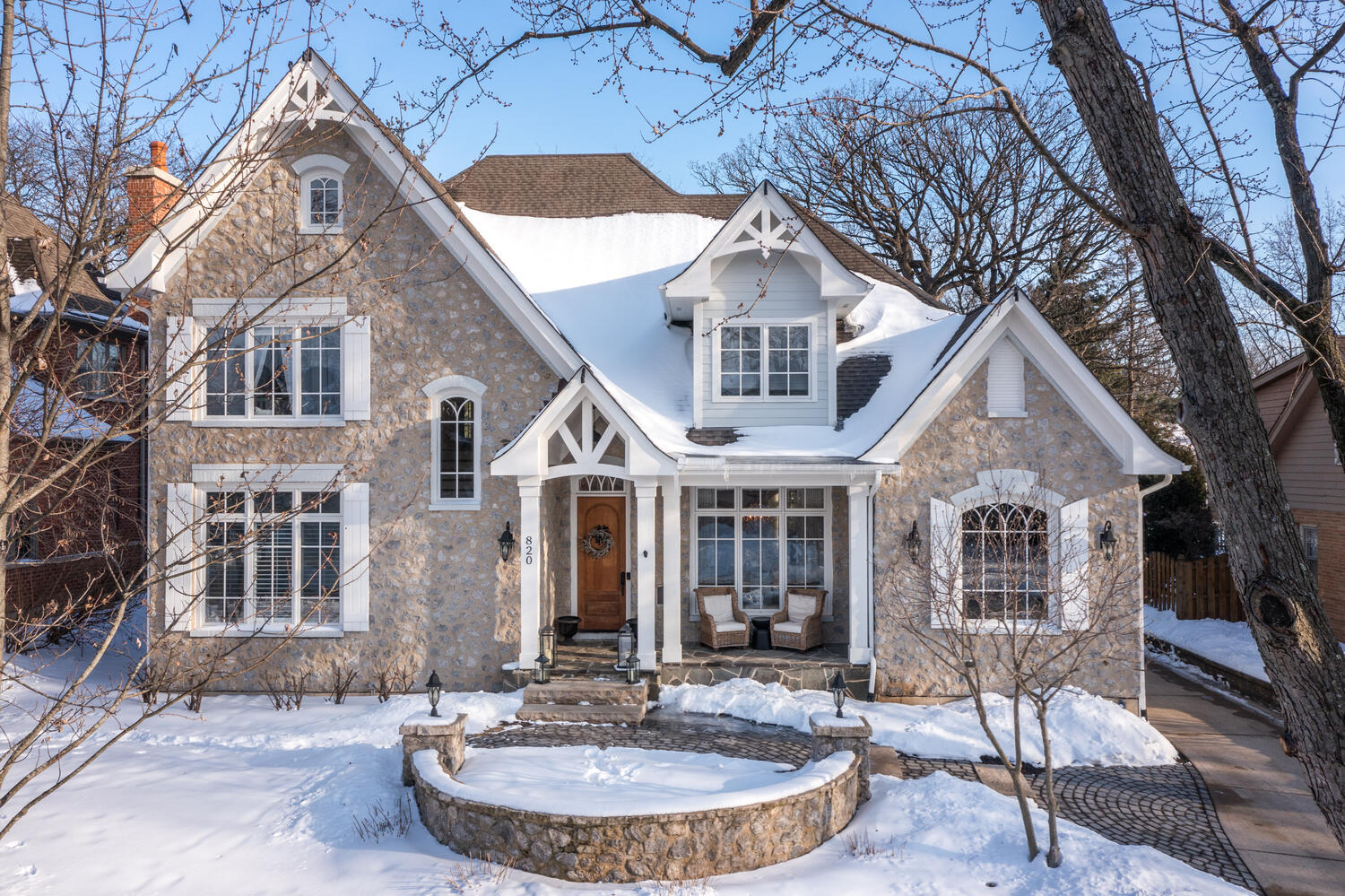 820 Wellner Road Naperville, IL 60540 - Photo 1 of 52 a front view of a house with a yard garage and outdoor seating