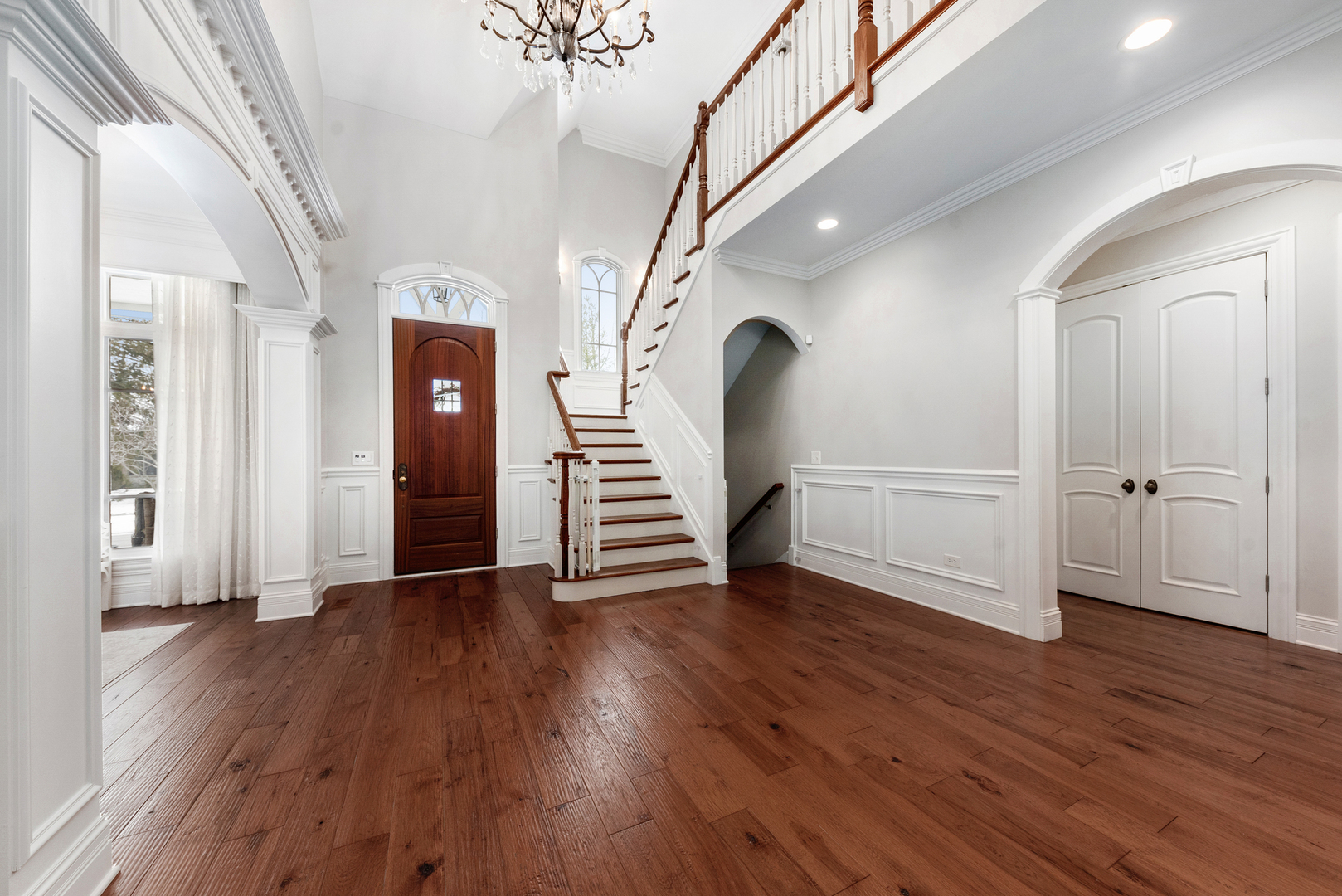 820 Wellner Road Naperville, IL 60540 - Photo 14 of 52 a view of an empty room with wooden floor and a window