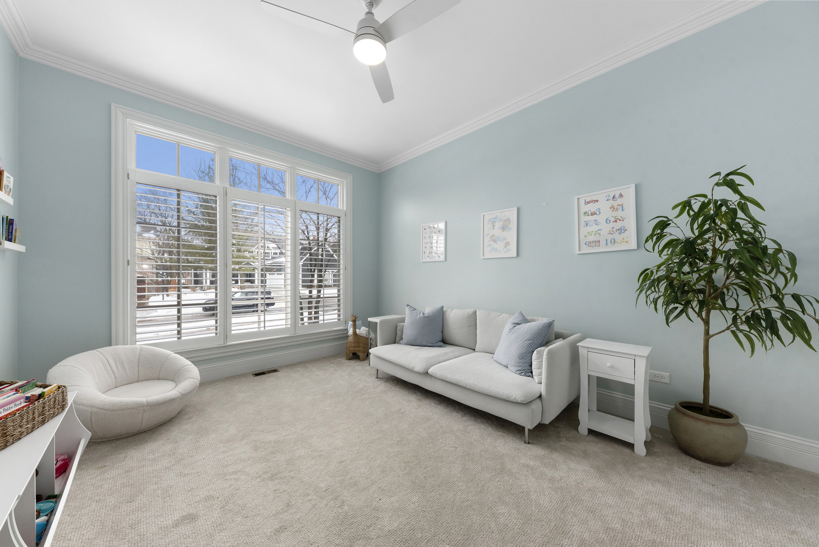 820 Wellner Road Naperville, IL 60540 - Photo 16 of 52 a living room with furniture and a potted plant