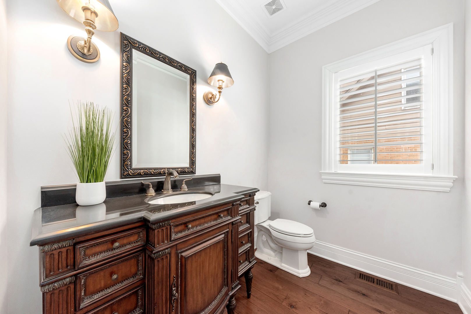 820 Wellner Road Naperville, IL 60540 - Photo 24 of 52 a bathroom with a granite countertop sink a toilet and a mirror