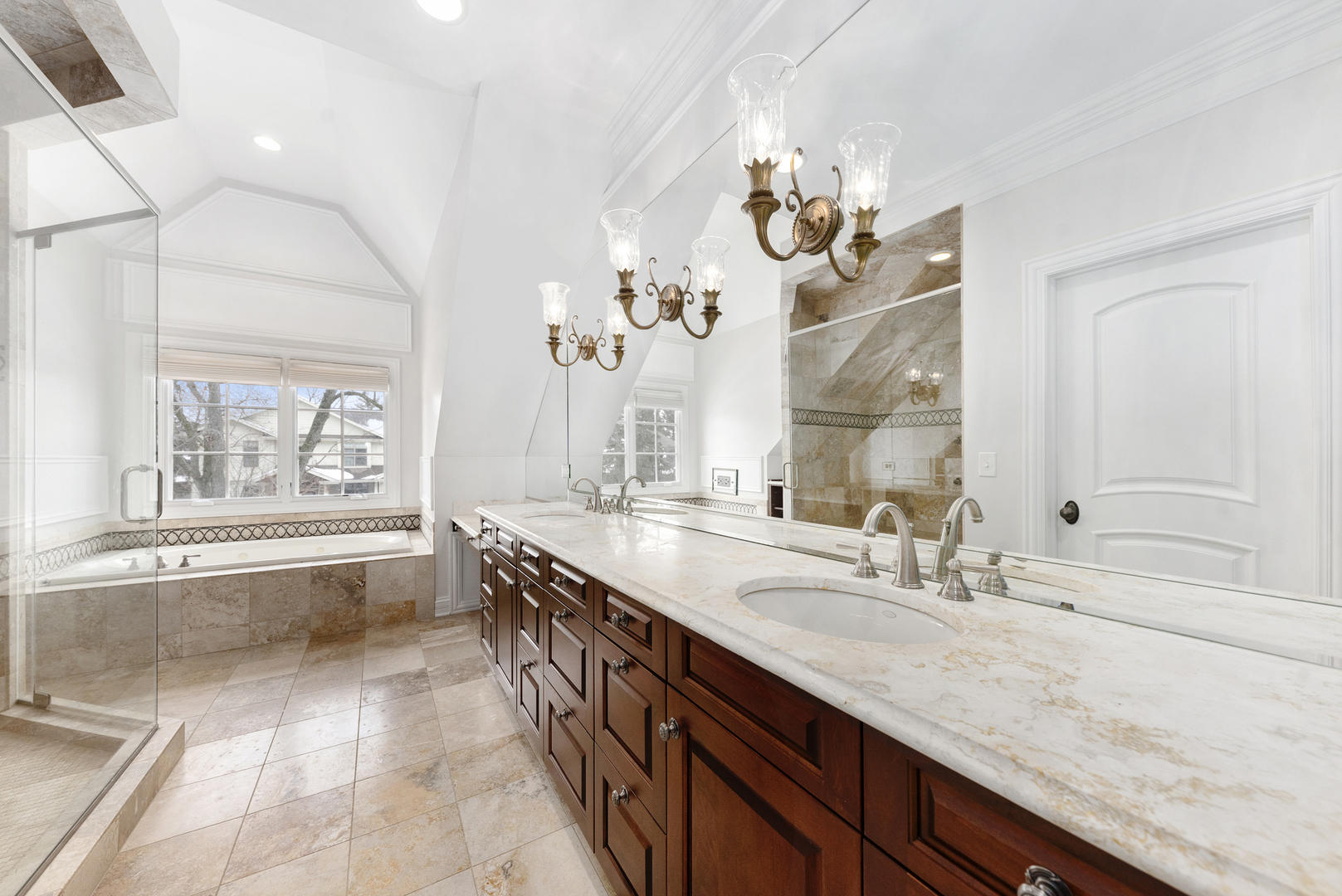 820 Wellner Road Naperville, IL 60540 - Photo 29 of 52 a spacious bathroom with a granite countertop sink a large mirror and a bathtub with shower