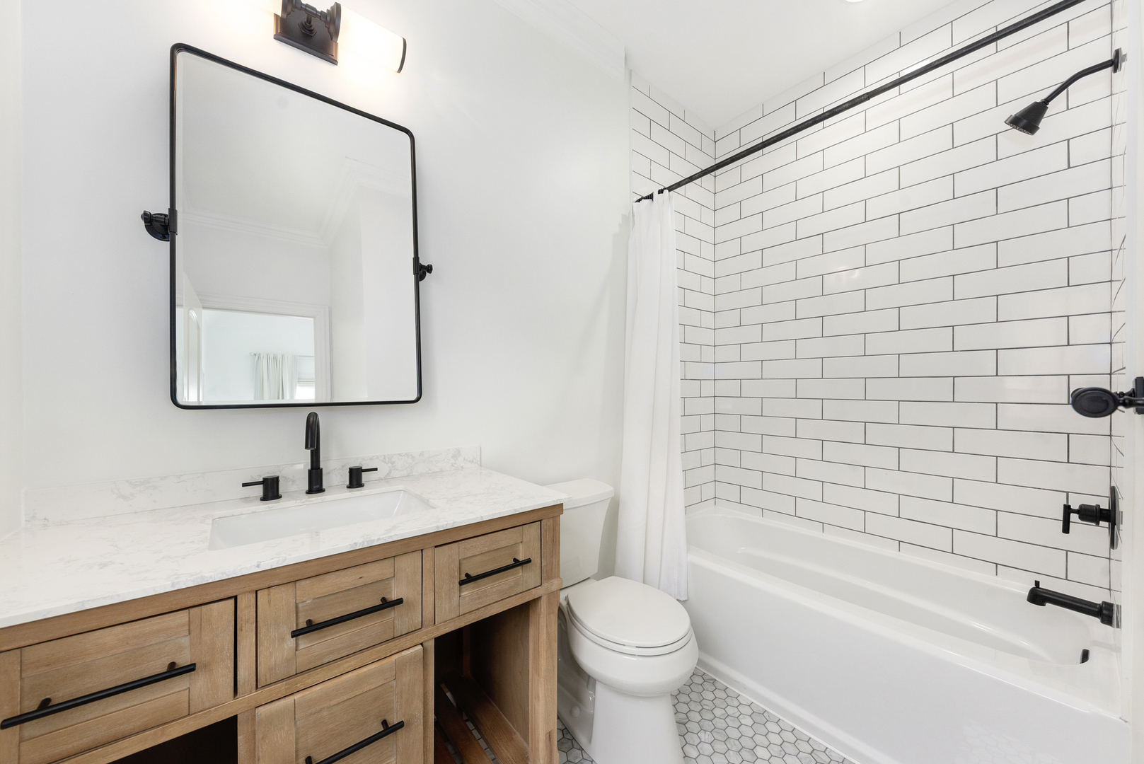 820 Wellner Road Naperville, IL 60540 - Photo 33 of 52 a bathroom with a sink toilet and shower
