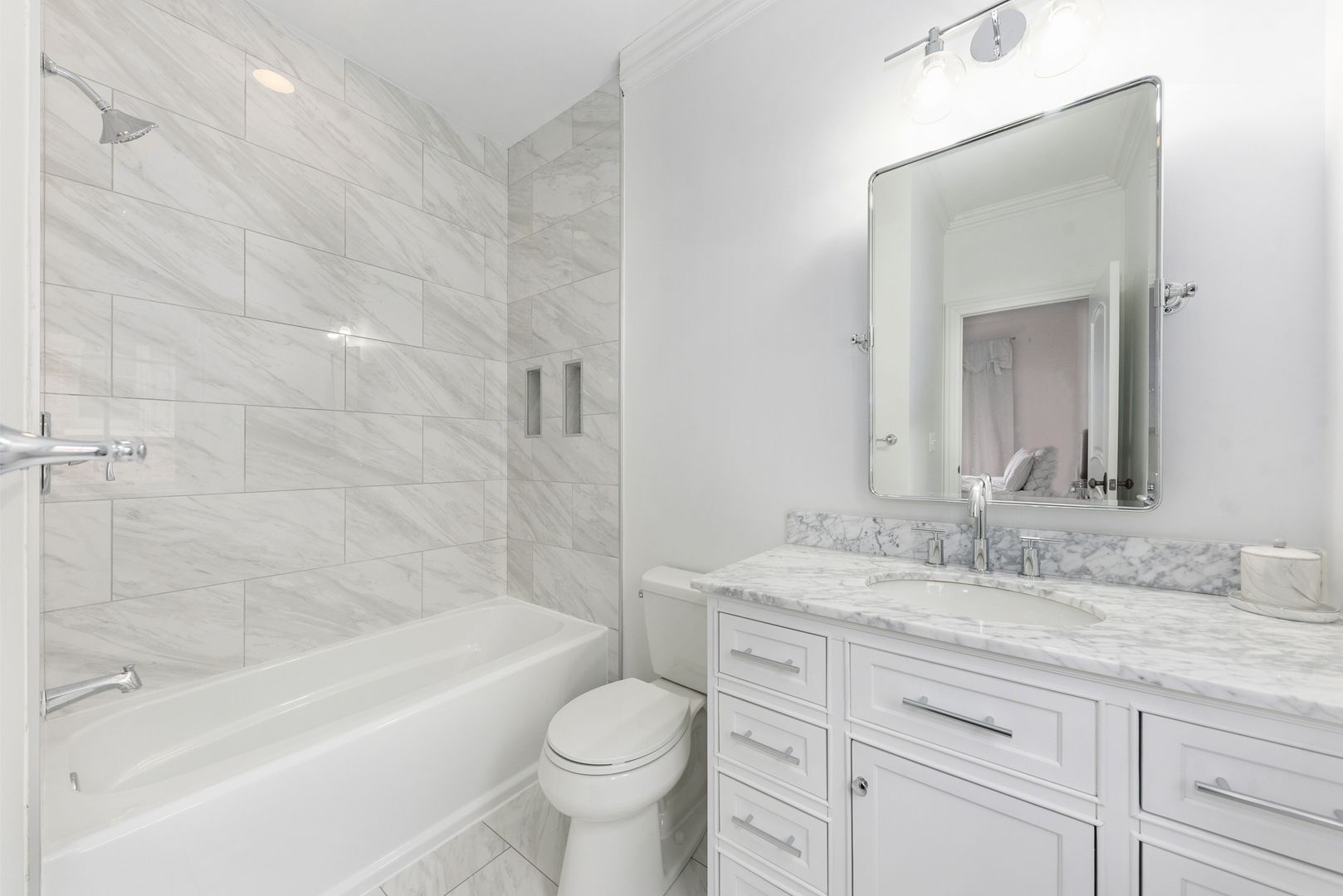 820 Wellner Road Naperville, IL 60540 - Photo 36 of 52 a bathroom with a granite countertop sink toilet mirror and bathtub