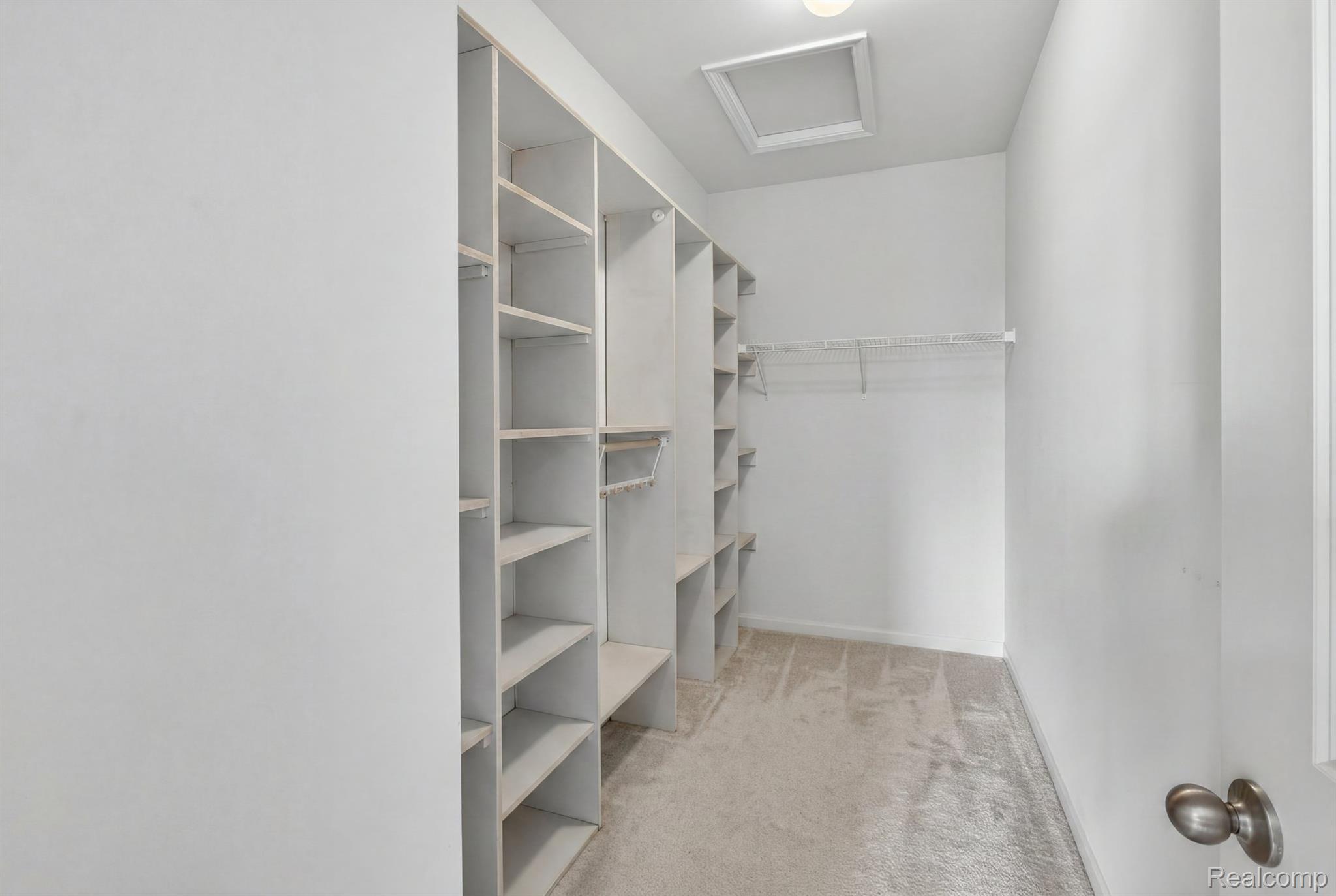 9812 Ridge Run, Unit 55 Howell, MI 48855 - Photo 15 of 23 Primary bedroom closet