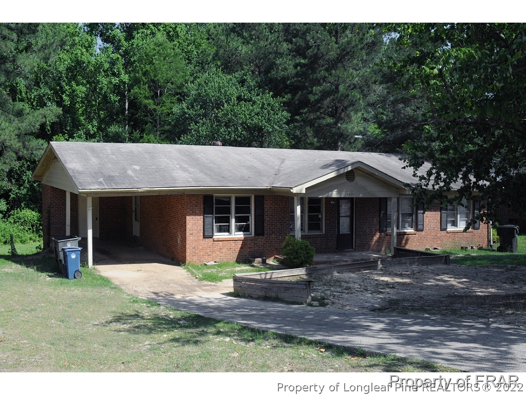 4435 Ruby Road Fayetteville, NC 28311 - Photo 1 of 2 a front view of a house with garden