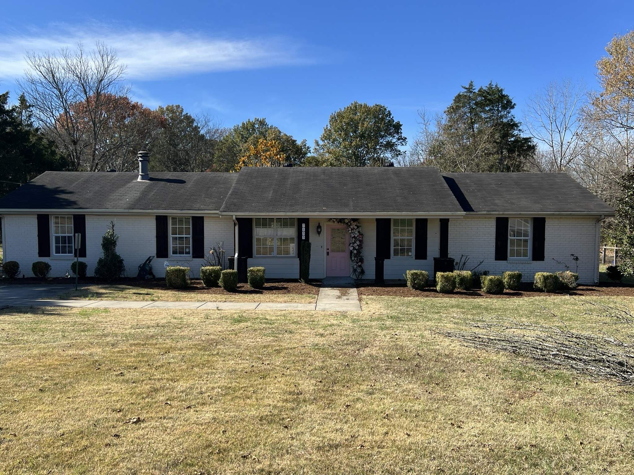 a front view of a house with a yard