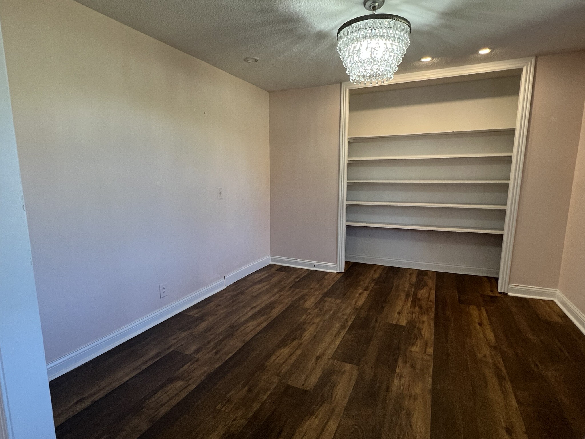 7155 Nolensville Road Nolensville, TN 37135 - Photo 13 of 24 a view of room with wooden floor and a chandelier