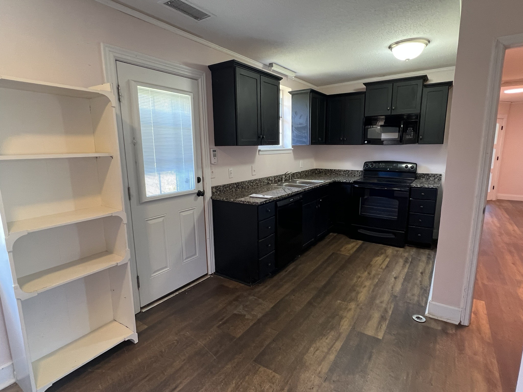 7155 Nolensville Road Nolensville, TN 37135 - Photo 14 of 24 a kitchen with a stove and a refrigerator