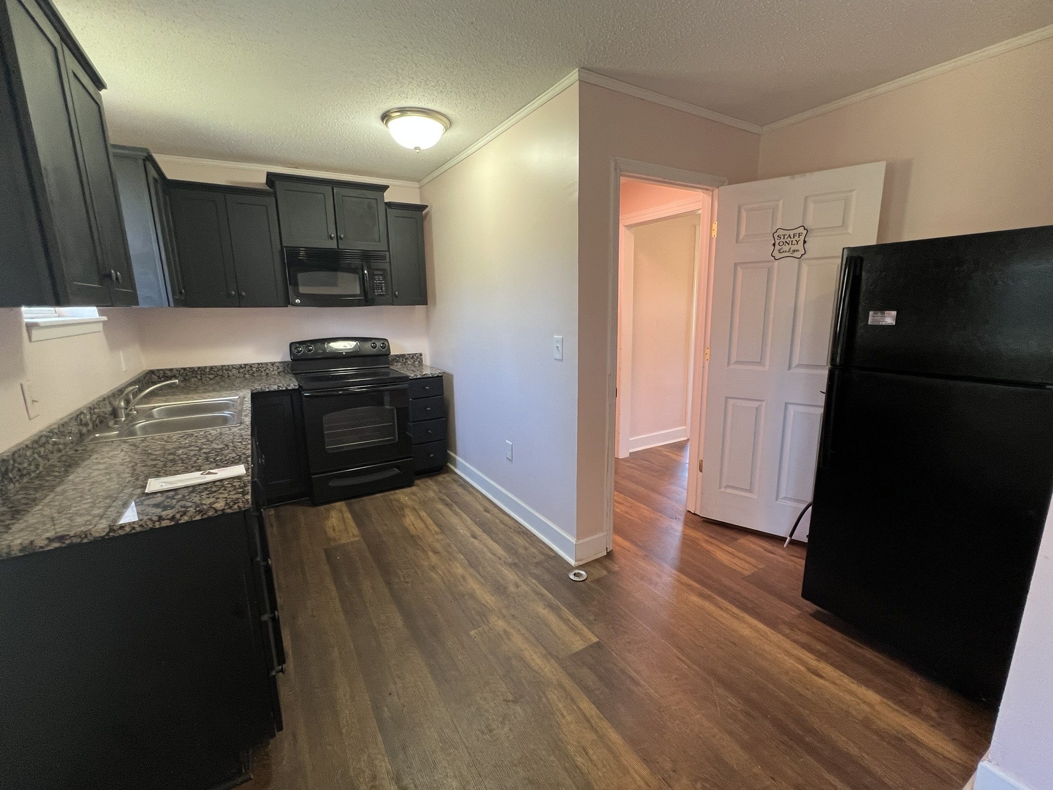7155 Nolensville Road Nolensville, TN 37135 - Photo 15 of 24 a kitchen with granite countertop a refrigerator and a sink