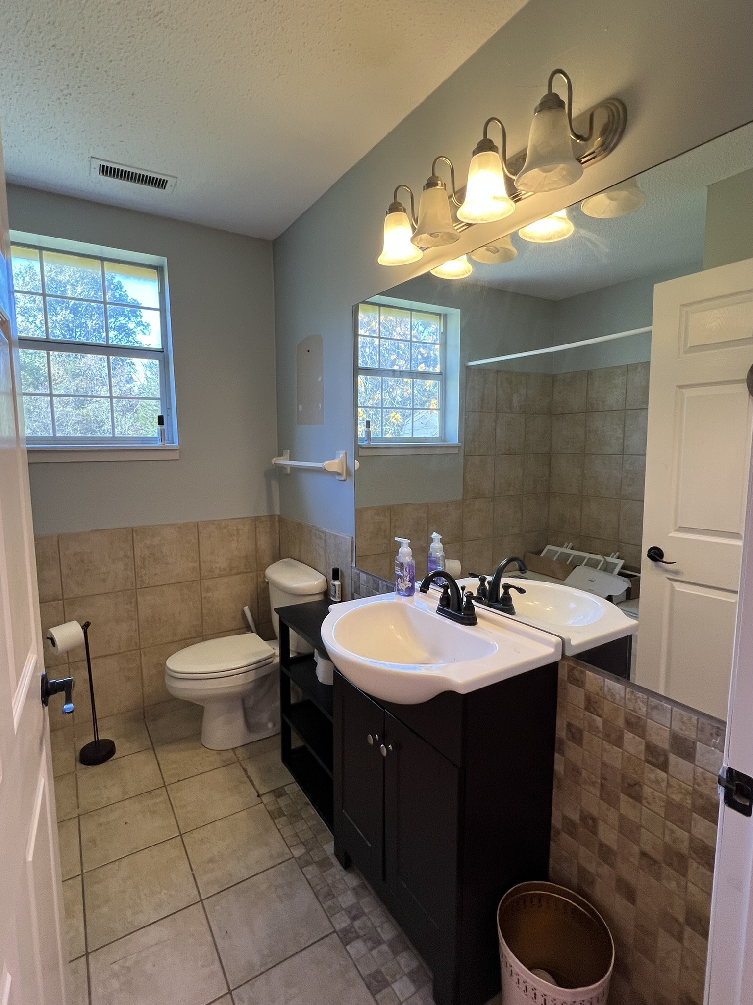 7155 Nolensville Road Nolensville, TN 37135 - Photo 17 of 24 a bathroom with a sink toilet and mirror
