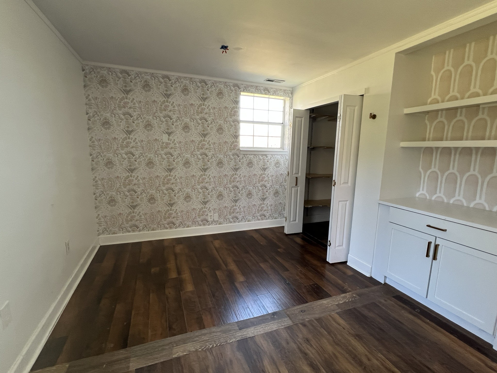 7155 Nolensville Road Nolensville, TN 37135 - Photo 20 of 24 an empty room with wooden floor and cabinet