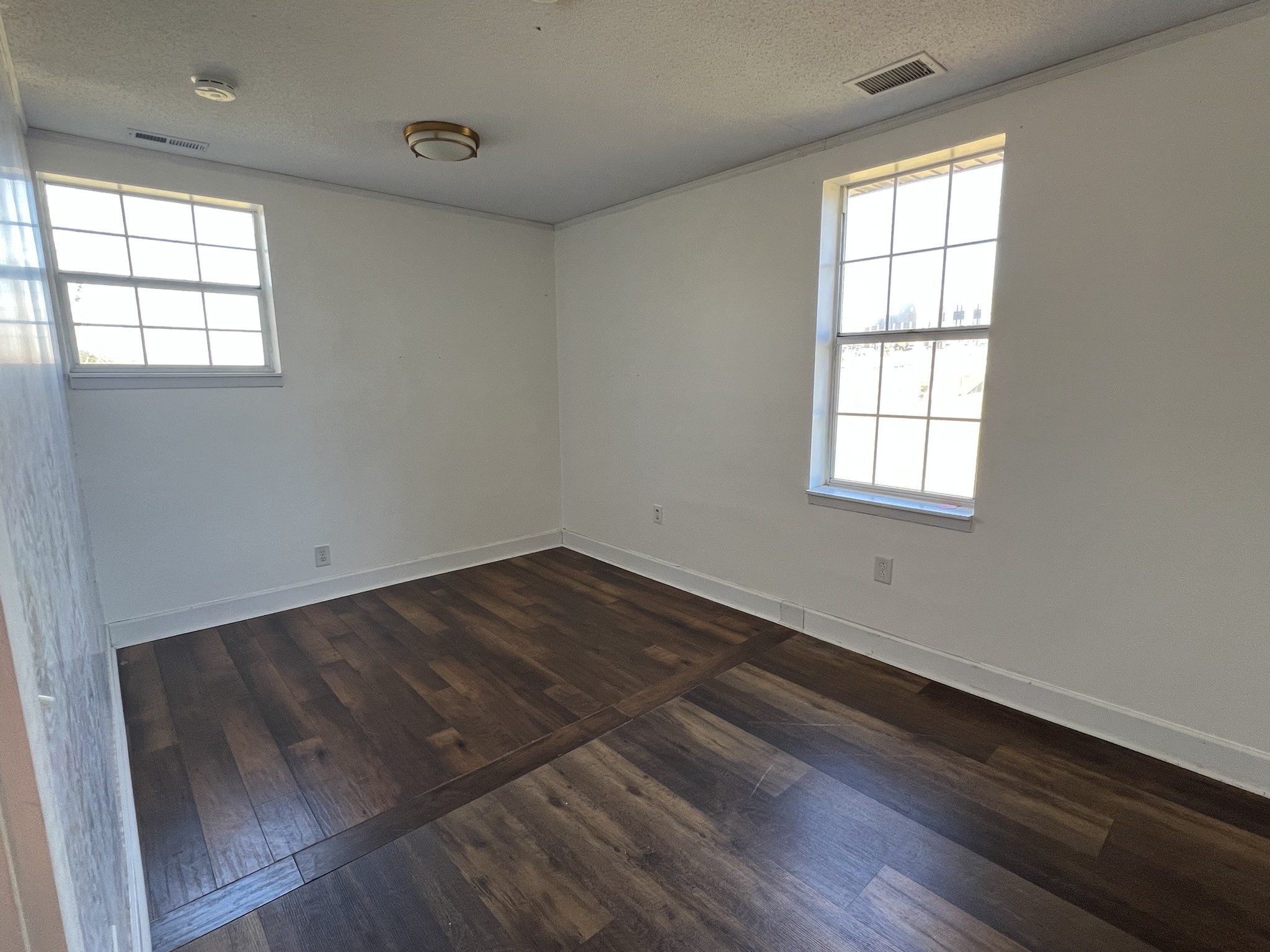 7155 Nolensville Road Nolensville, TN 37135 - Photo 22 of 24 an empty room with wooden floor and windows