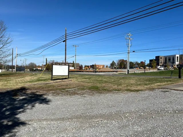a view of a street with a building in the background