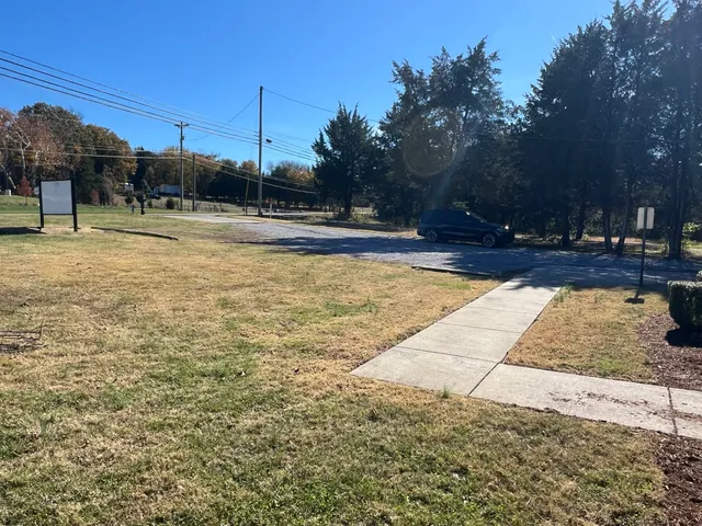 a view of a swimming pool with an outdoor space and seating area