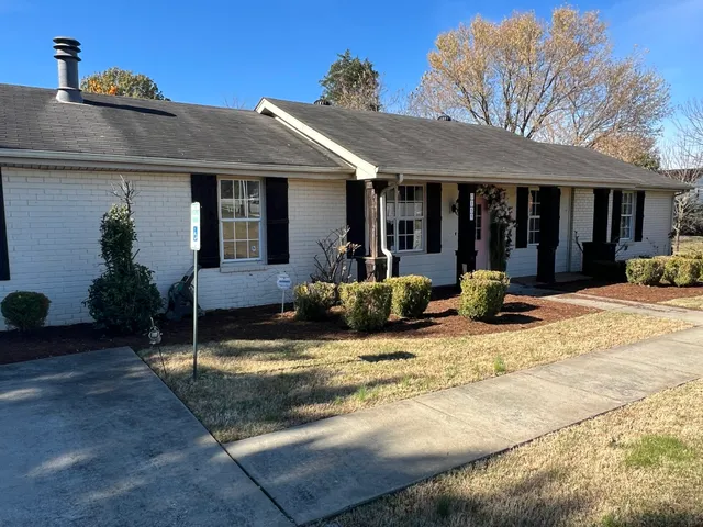 front view of a house with a patio