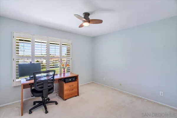 a workspace with furniture and windows