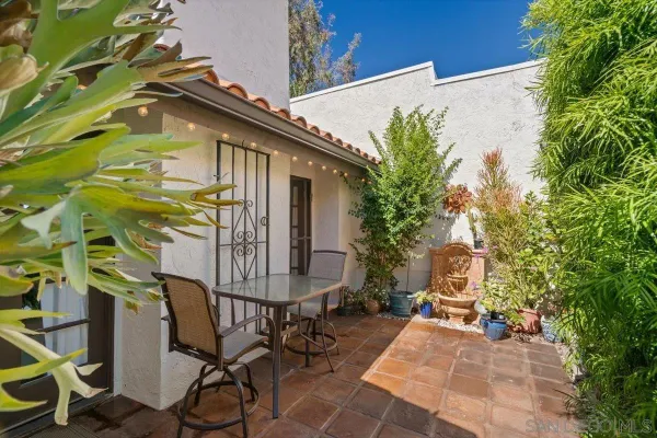 a view of backyard with a patio and outdoor seating