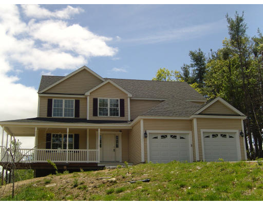 63 Rindge State Road Ashburnham, MA 01430 - Photo 1 of 1 a front view of a house with a yard