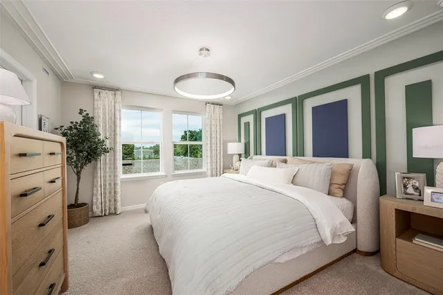 a bedroom with a large bed and a large window