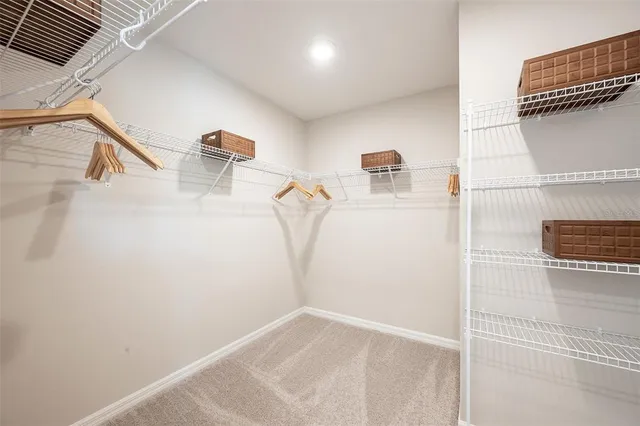 a view of storage and utility room with empty racks