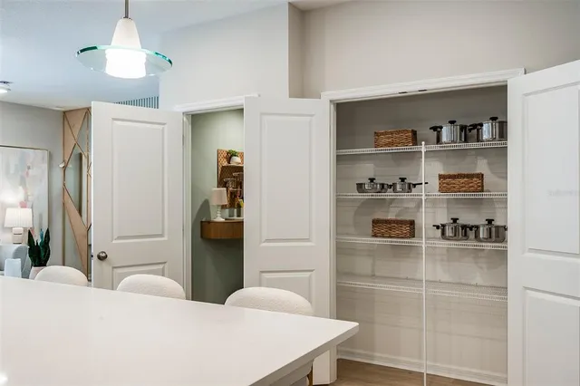 a bedroom with a bed and a cabinets