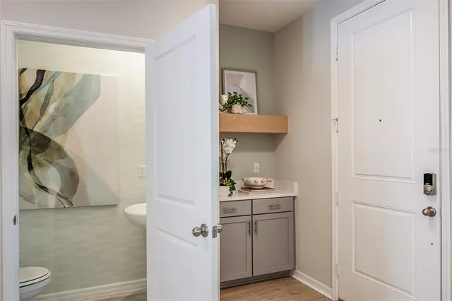 a bathroom with a sink toilet and mirror