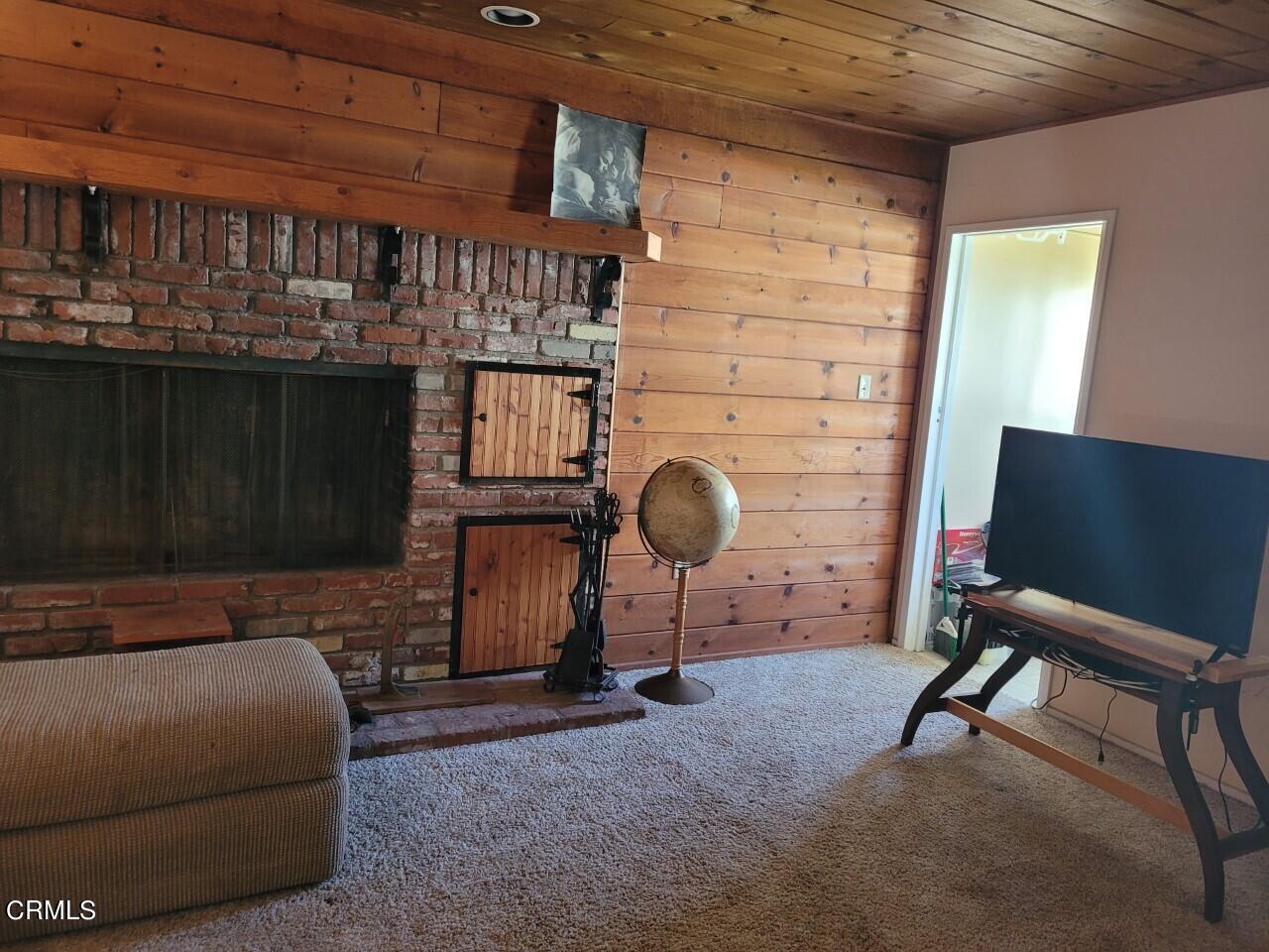 119 Lark Street Oxnard, CA 93033 - Photo 5 of 14 a room with furniture and a fireplace