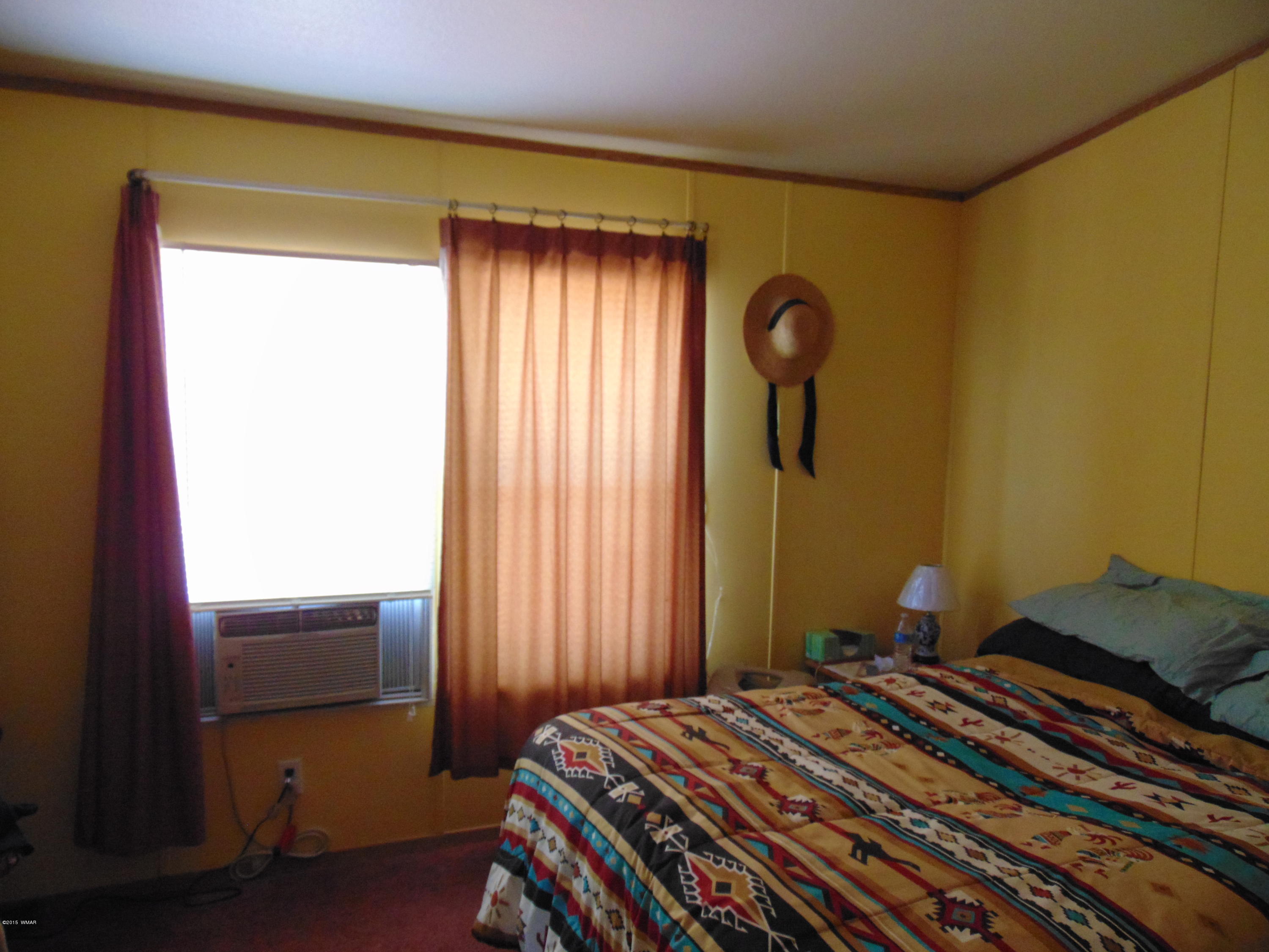 4389 Mountain View Road Snowflake, AZ 85937 - Photo 20 of 82 a bedroom with a bed and a window