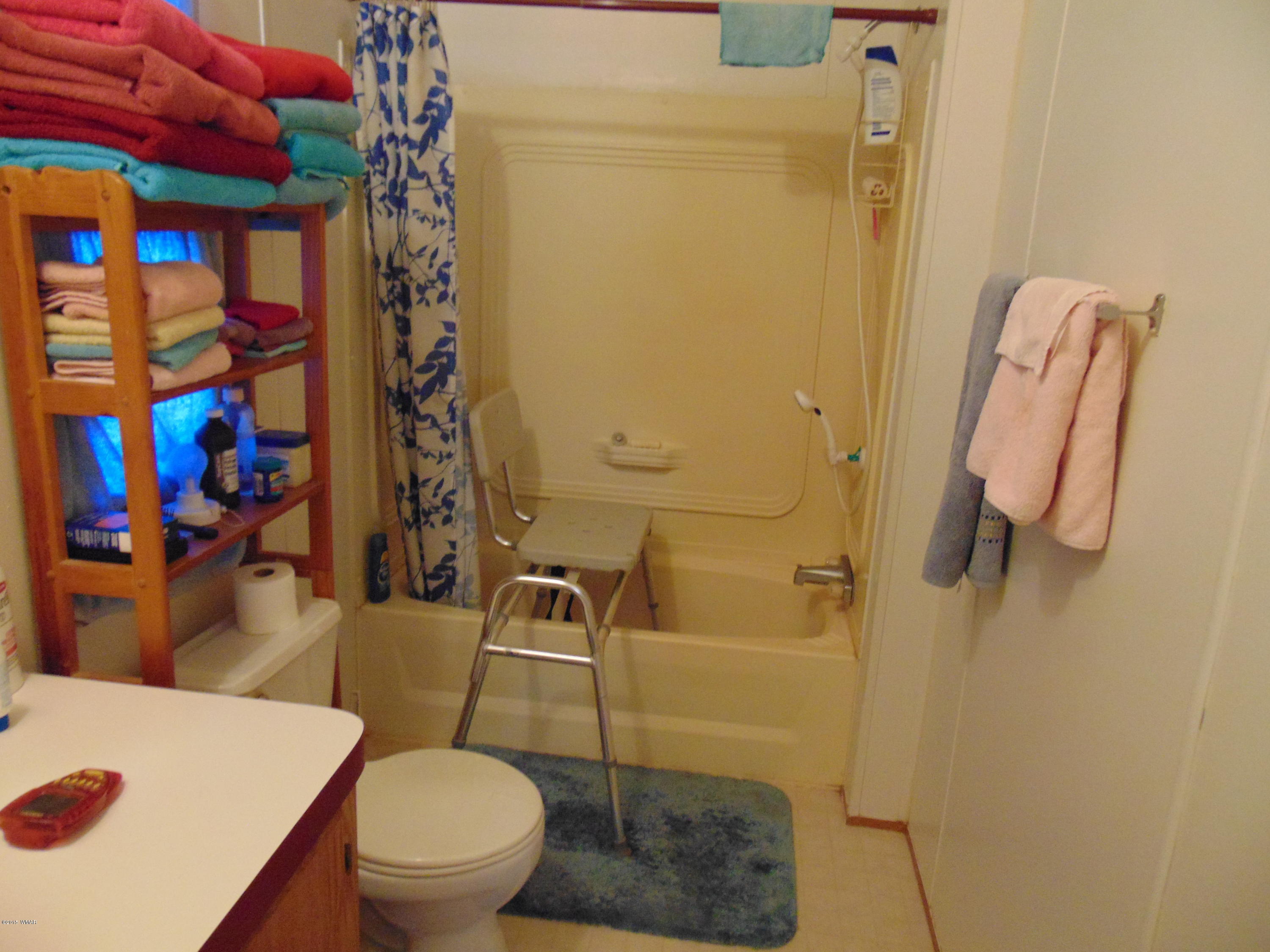 4389 Mountain View Road Snowflake, AZ 85937 - Photo 23 of 82 a white toilet sitting next to a bathroom sink
