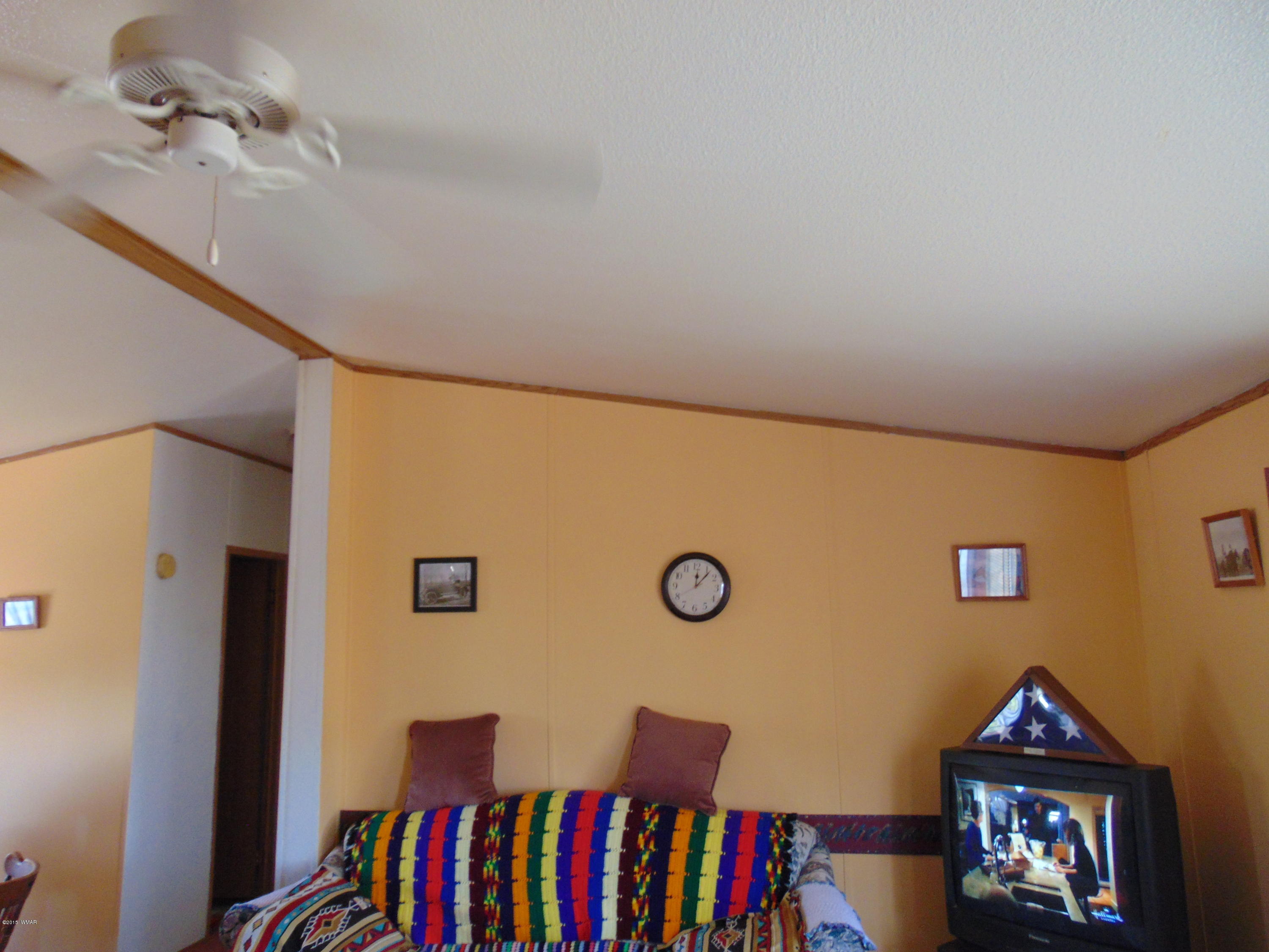 4389 Mountain View Road Snowflake, AZ 85937 - Photo 38 of 82 a view of a livingroom with furniture and book shelf