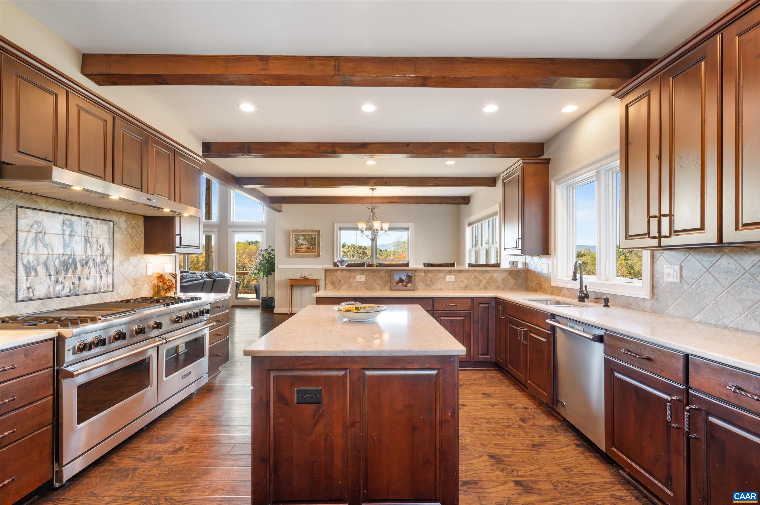 2236 Craigs Store Road Afton, VA 22920 - Photo 18 of 75 a kitchen with wooden cabinets and stainless steel appliances
