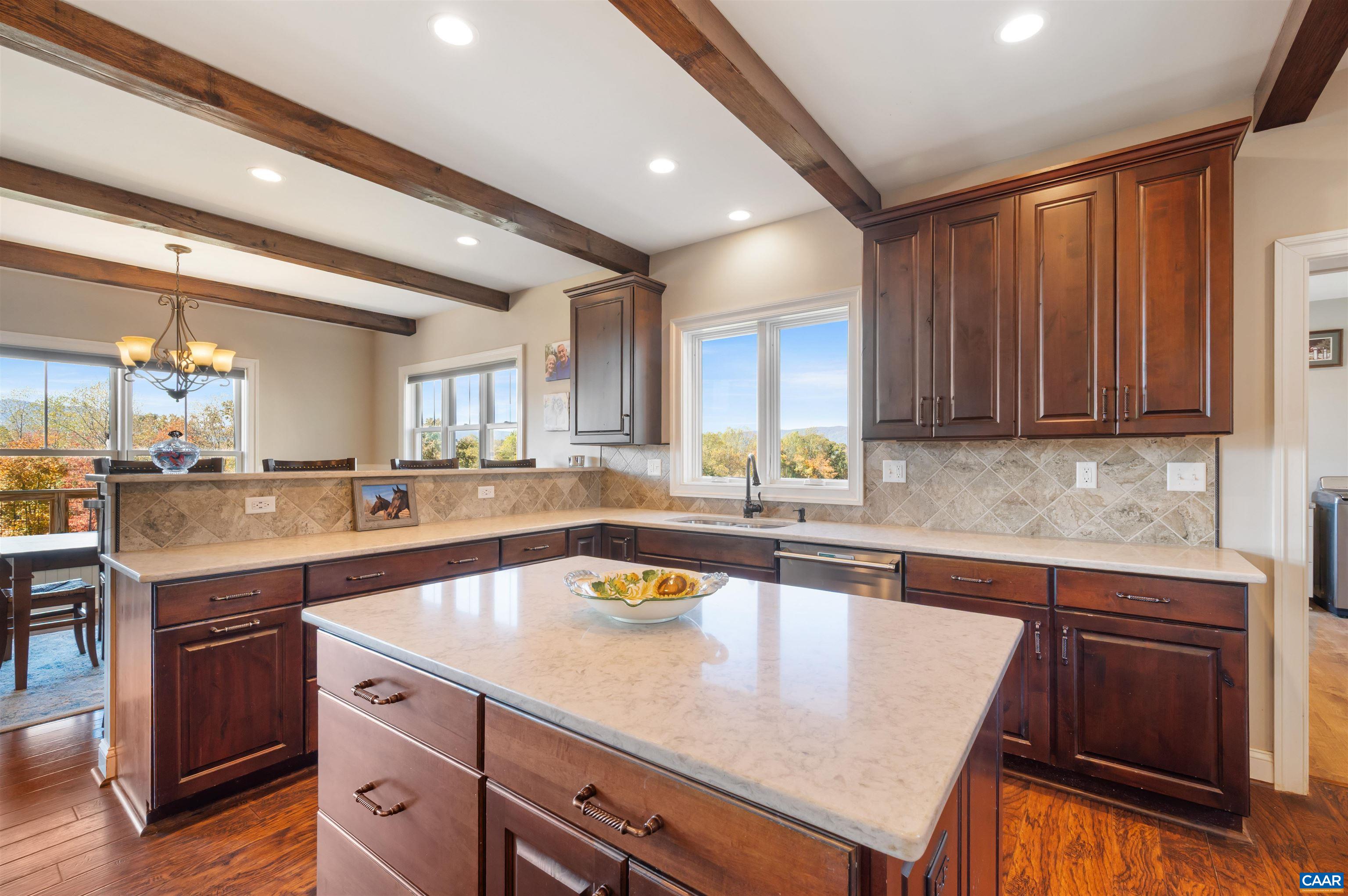 2236 Craigs Store Road Afton, VA 22920 - Photo 19 of 75 a kitchen with granite countertop a sink stove and cabinets