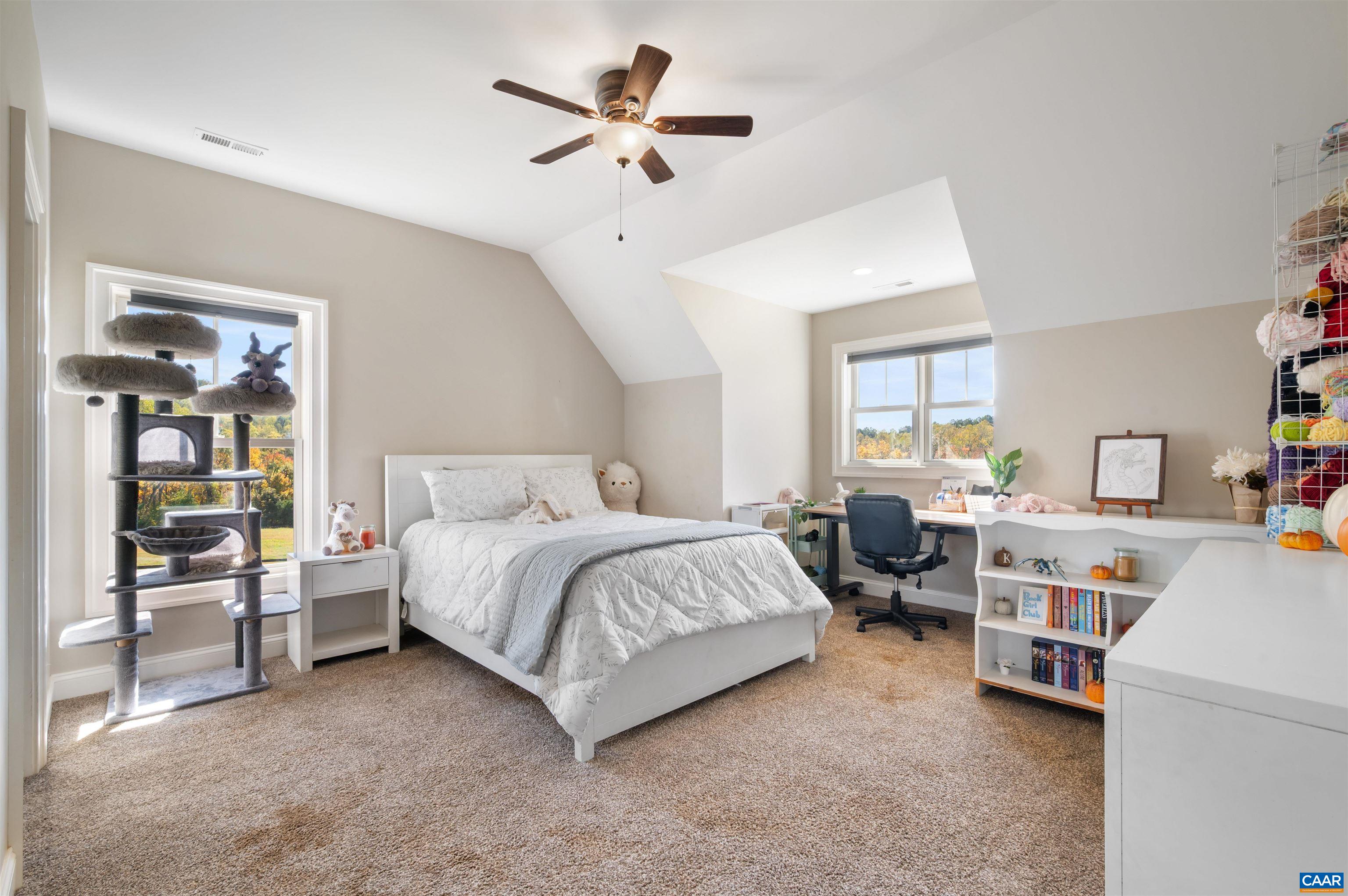2236 Craigs Store Road Afton, VA 22920 - Photo 32 of 75 a spacious bedroom with a bed couch and a window