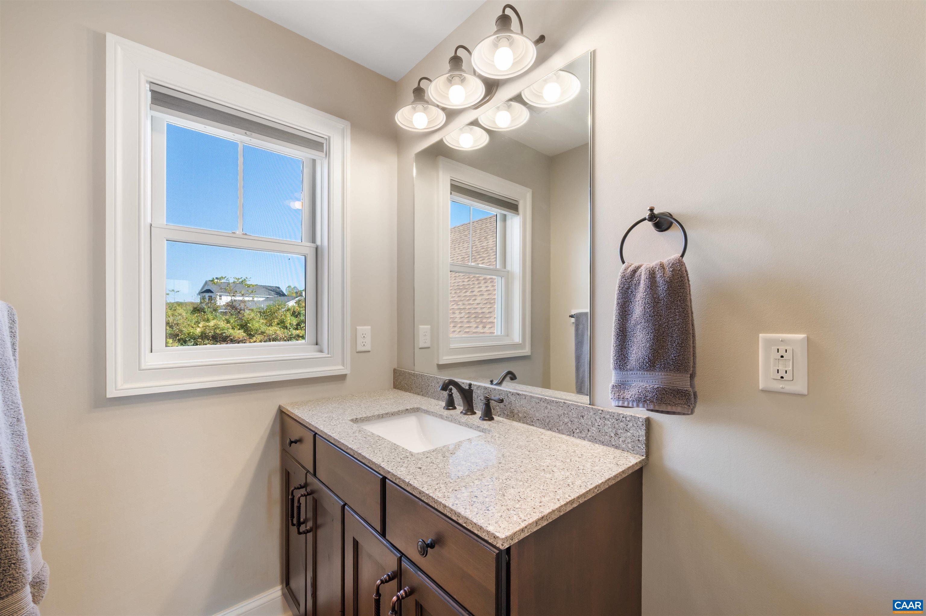 2236 Craigs Store Road Afton, VA 22920 - Photo 33 of 75 a bathroom with a sink a vanity and a mirror